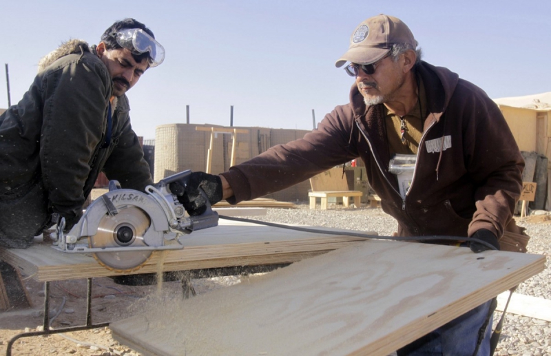 charpentier-AIGLUN-min_men_working_construction_sawing_wood_building_marines_workers_equipment-1064481